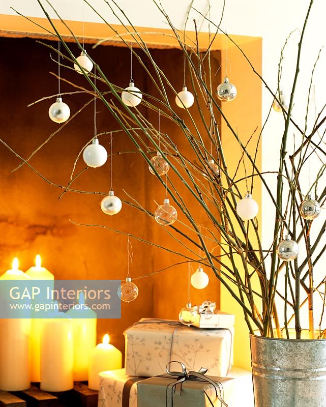 Modern Christmas decorations and lit candles
