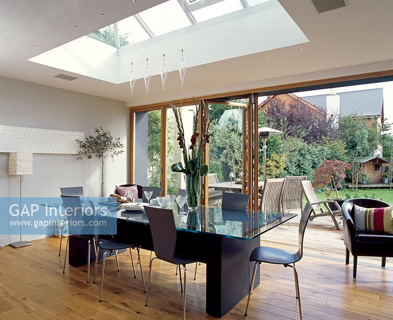 Dining room with open french doors and view of garden