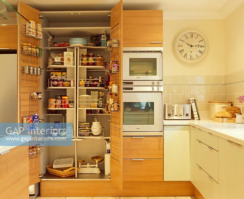 Open food cupboard in kitchen