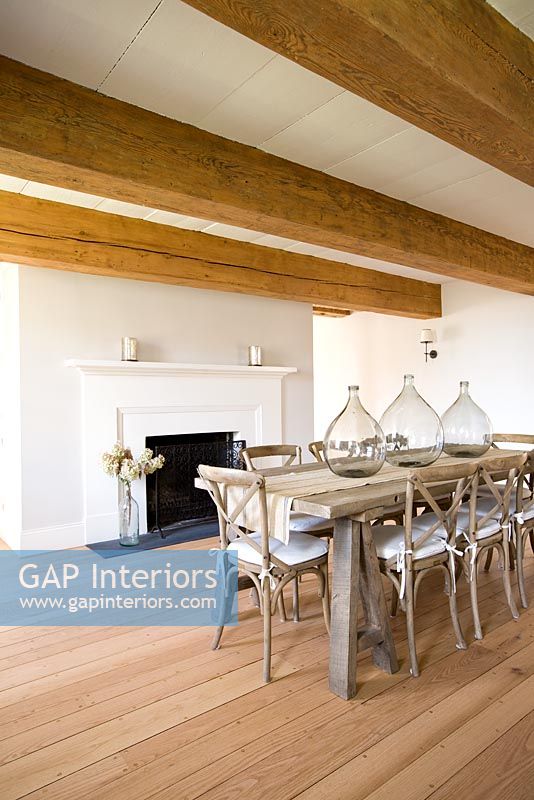 Dining room with fireplace and exposed beams