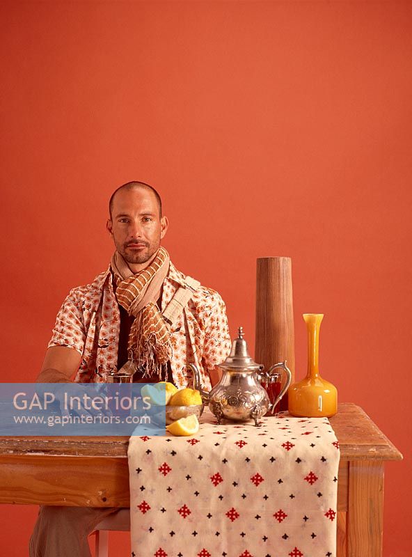 Man sitting at a table with tea