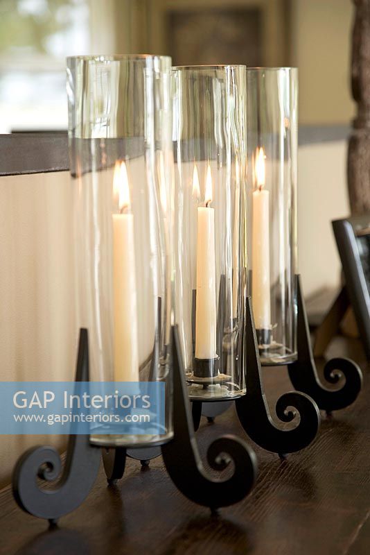 Hurricane lamps in a row