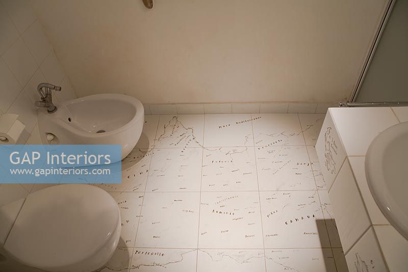 Bathroom with map on tiles
