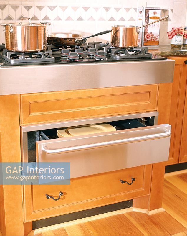 Modern kitchen cooker with storage drawers