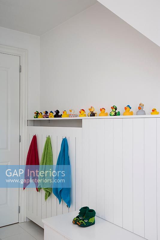 Collection of rubber ducks in modern bathroom