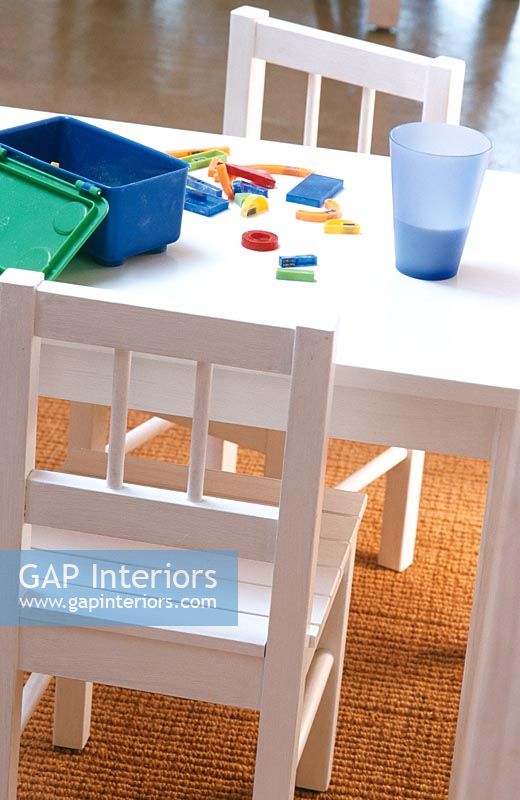 Table and chairs in childrens playroom
