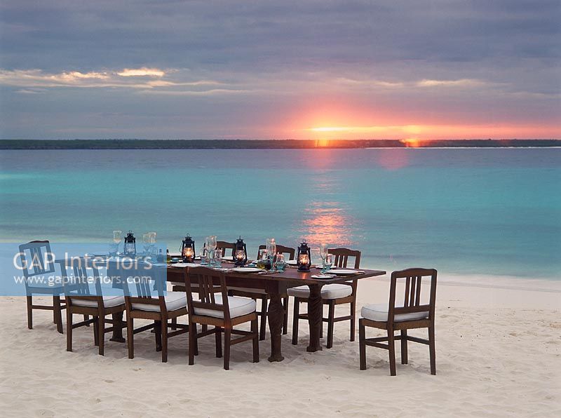 Dining table with chairs on beach