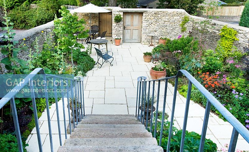 view down stone steps to the garden below