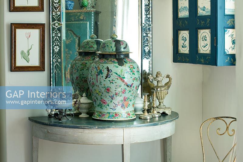 Console table with antiques on display
