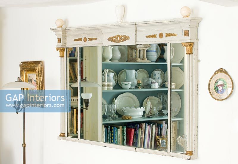 Reflection of bookcase in mirror