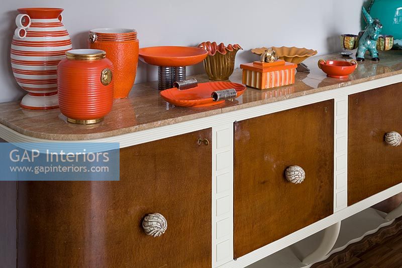Collectibles on display on retro sideboard