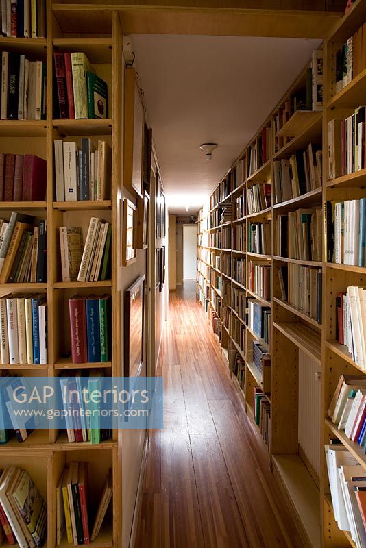 Hallway lined with bookshelves