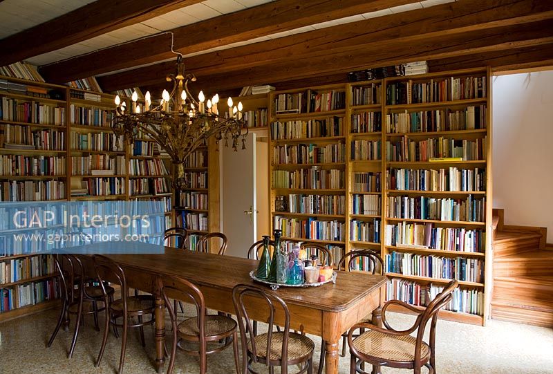 Dining area lined with bookshelves