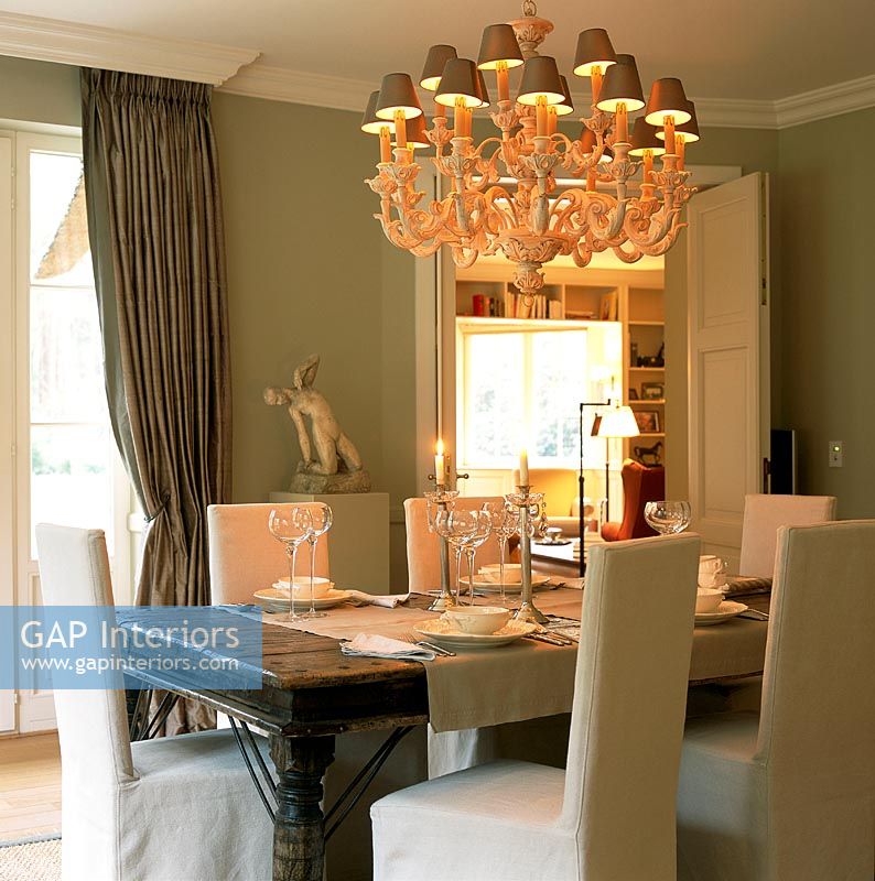 Modern dining room with elaborate chandelier