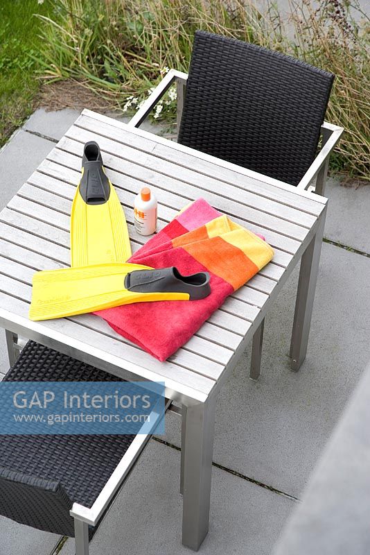Swimming accessories on exterior table