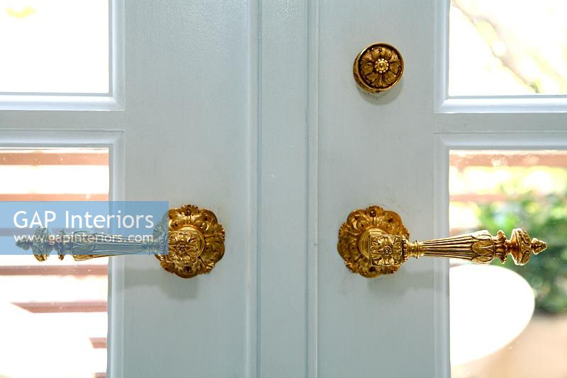 Detail of gold door handles 