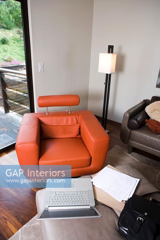Laptop and Modern Orange Leather Armchair