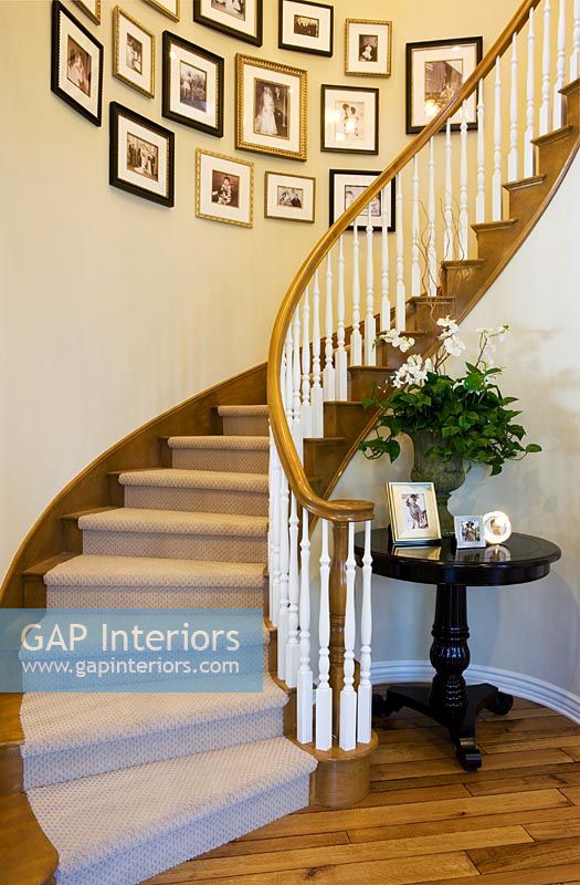 Curved staircase and pictures

