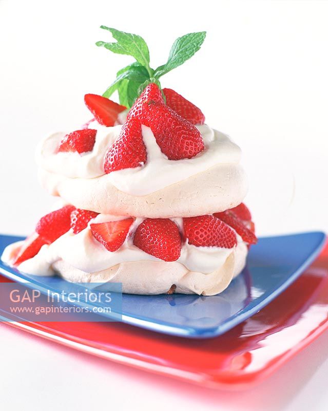 Meringue with strawberries, close-up 