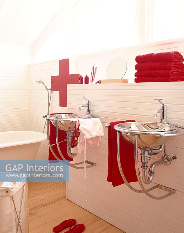 Bathroom sink with red towels