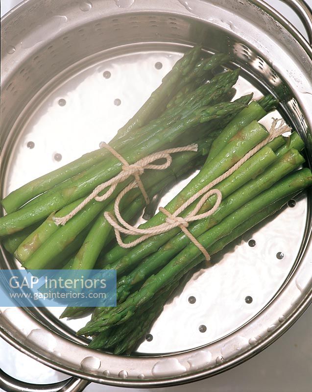 Two bunches of steamed asparagus