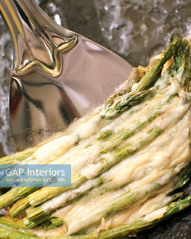 Cooked asparagus with cheese