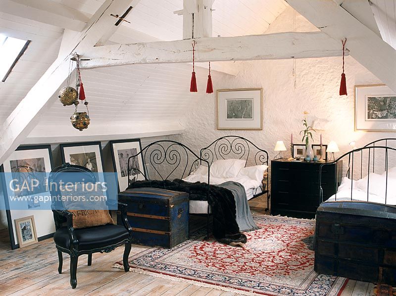 Attic bedroom with two beds