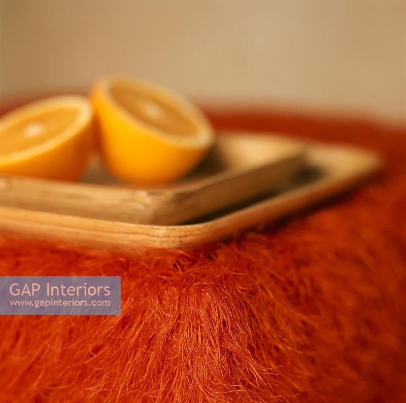 Sliced orange on a wood tray