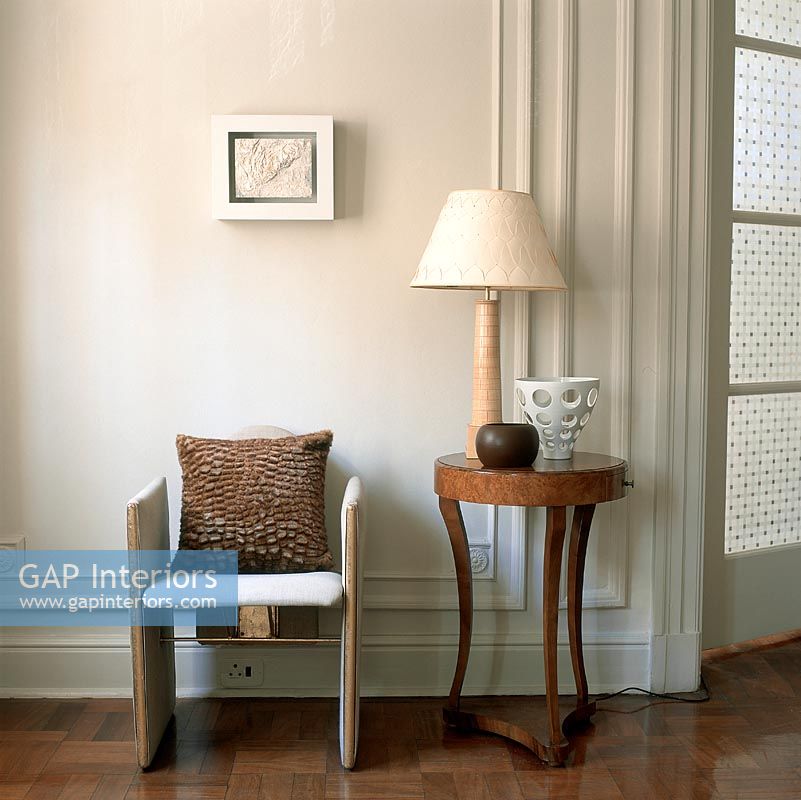 Armchair and side table with table lamp