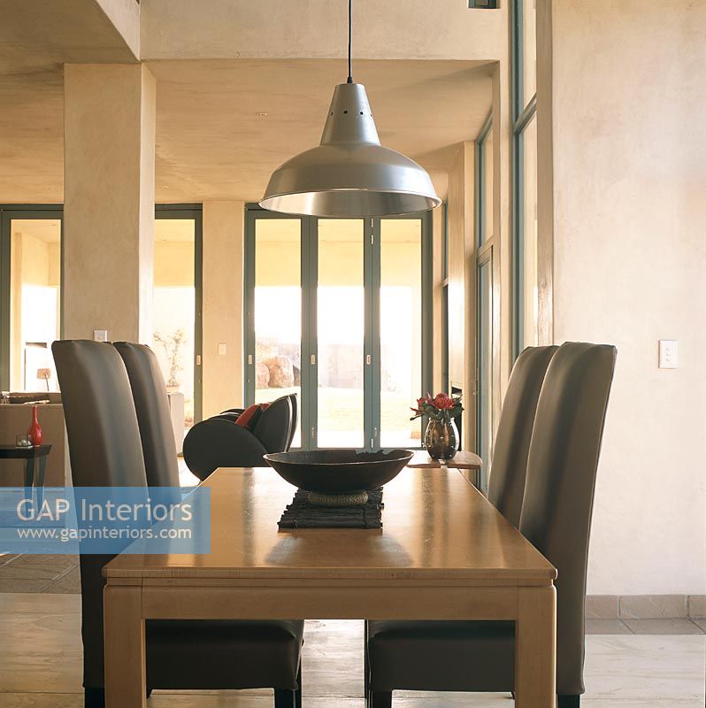 Modern dining room with hanging lamp