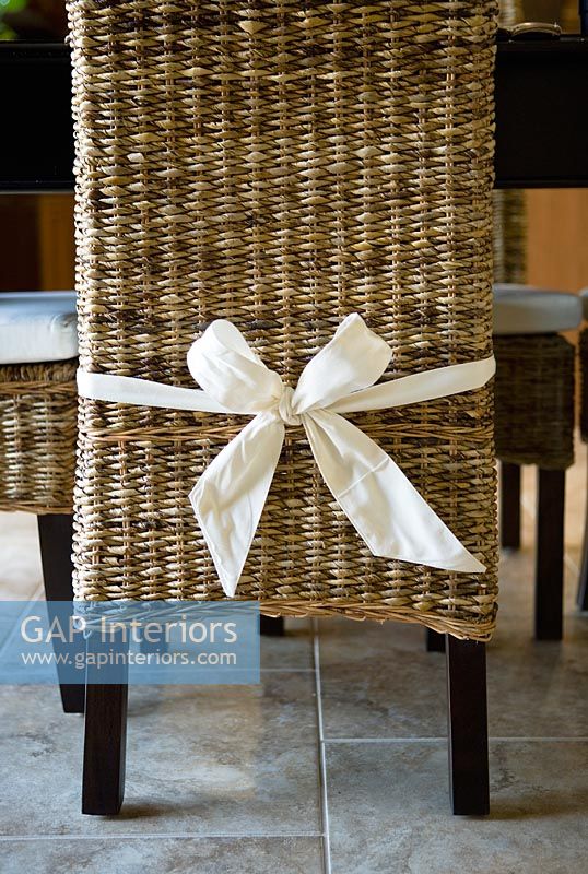 Bow tied around wicker dining chair