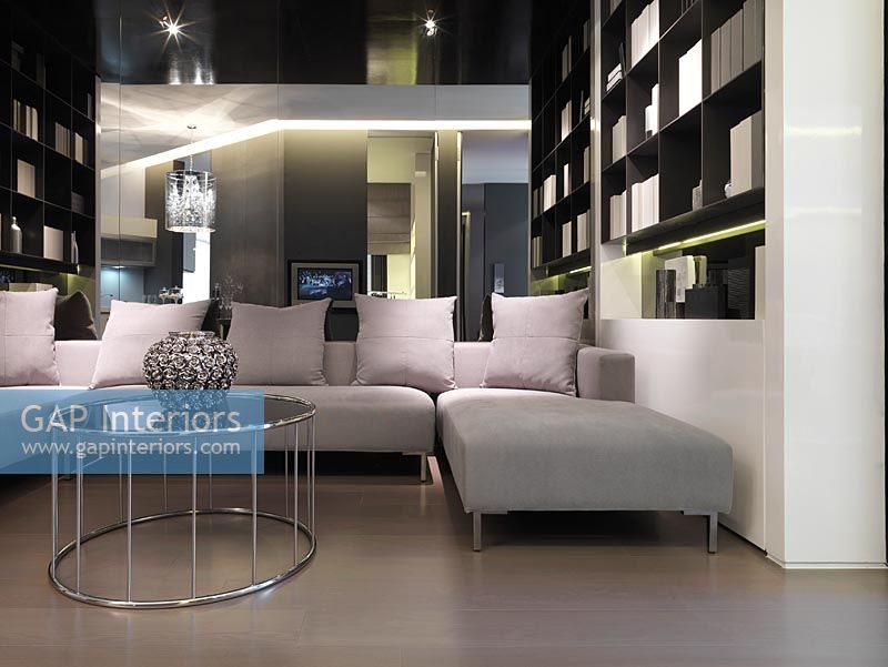 Modern sectional sofa in front of mirror