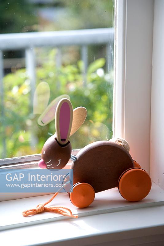 Toy on childrens room windowsill, detail