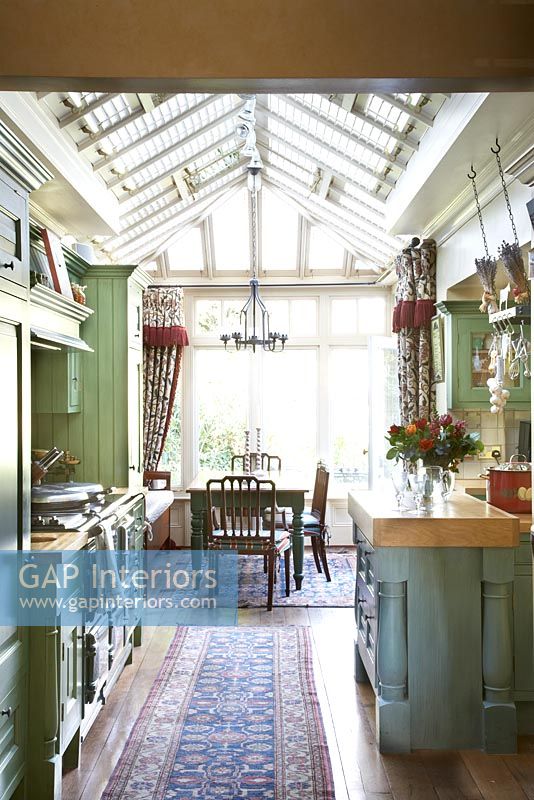 Kitchen to conservatory with dinning table 