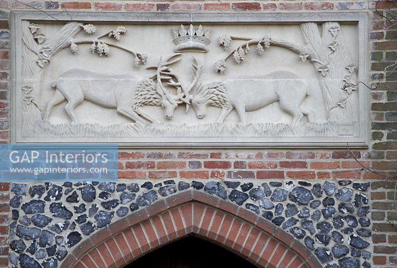 Two stags fighting in stone