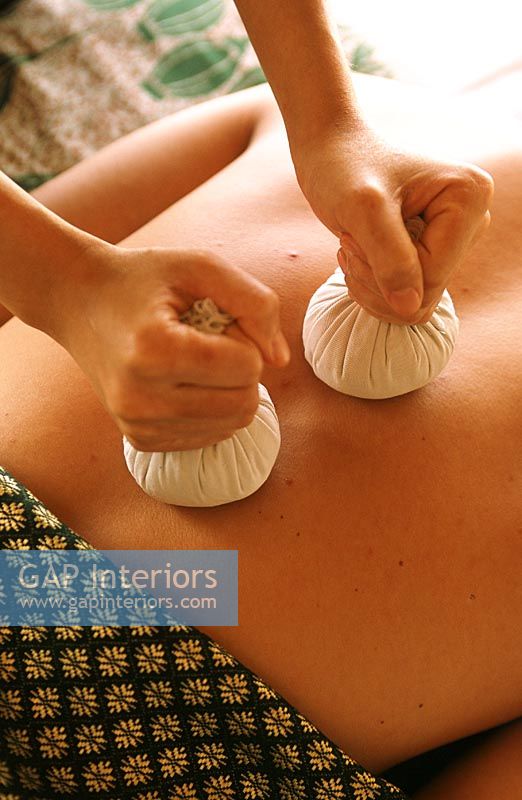 Person receiving hot stone massage