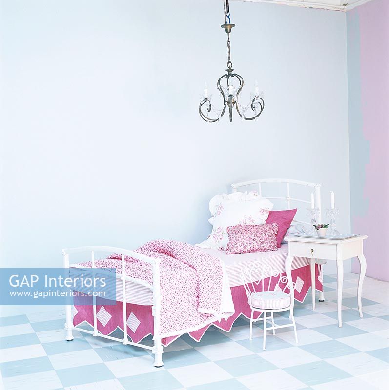 Childrens bedroom with bed and chandelier