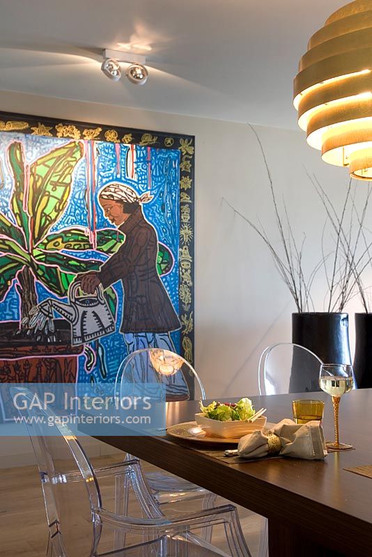 Large painting in modern dining room 