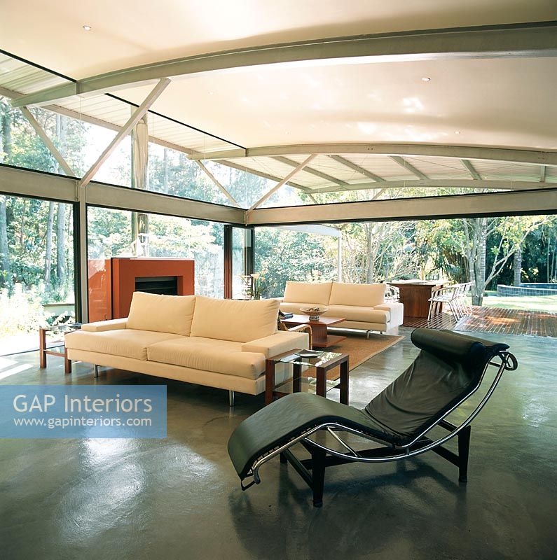 Spacious modern living room with Le Corbusier chaise lounge