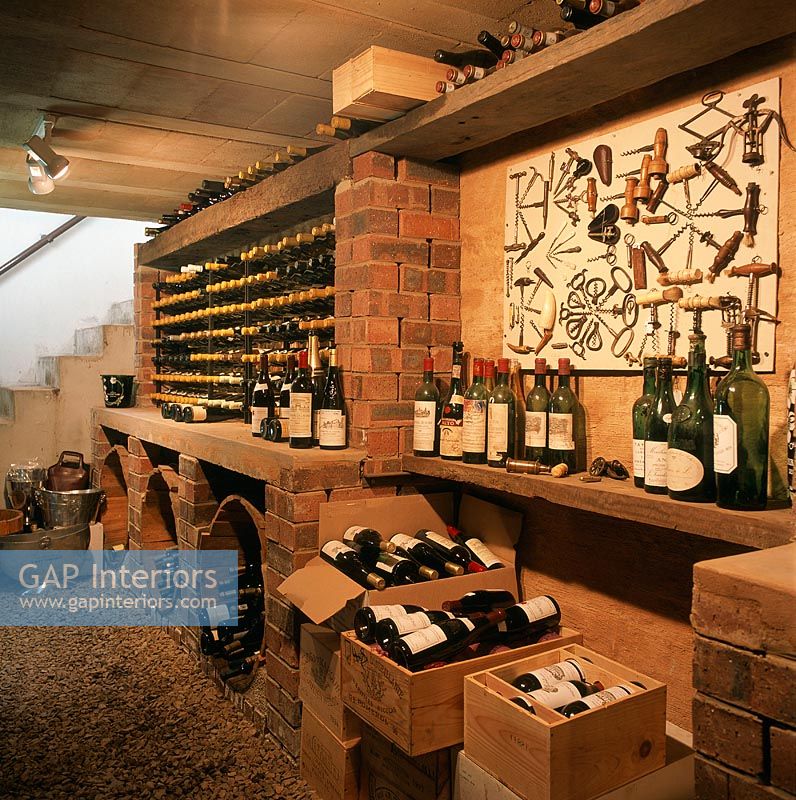 View of wine bottles and crates in wine cellar 