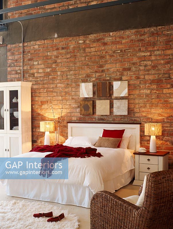 Luxury bedroom with brick wall 