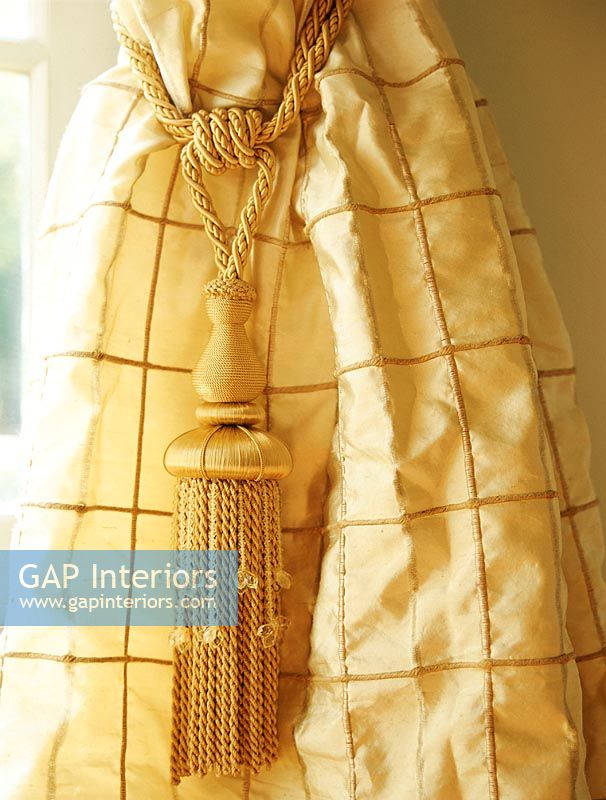 Close-up of a curtain tassel tie back 