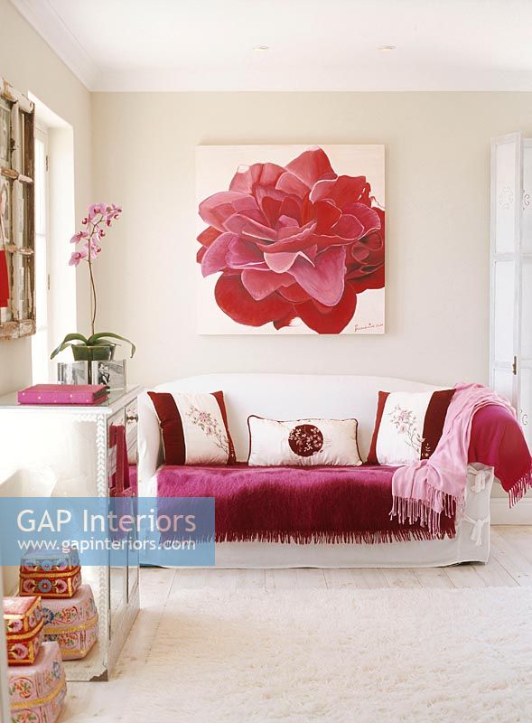 Modern living room with large painting of flower