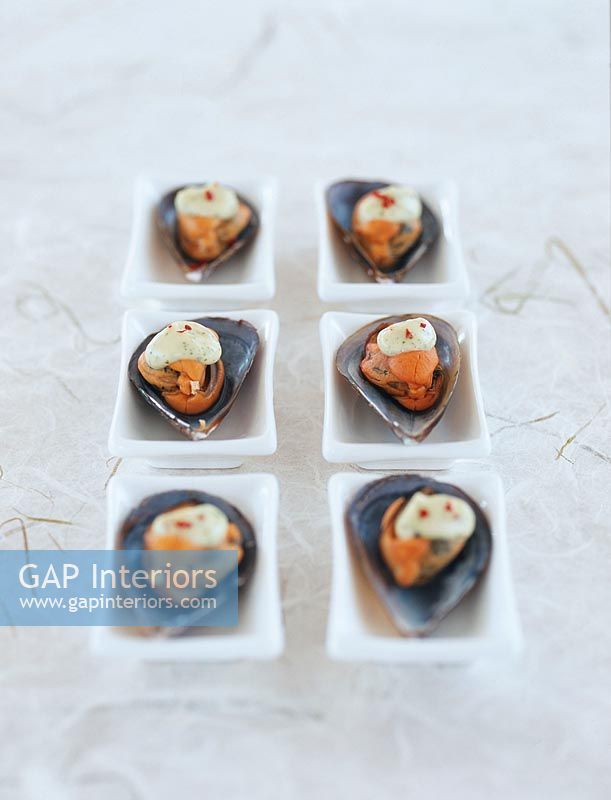 Mussel appetizers in a row