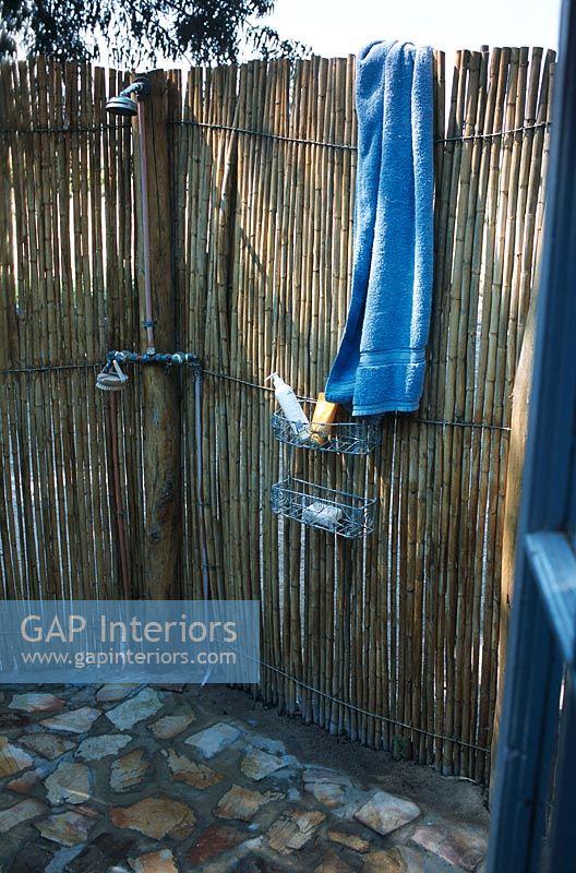An outdoor bamboo walled shower