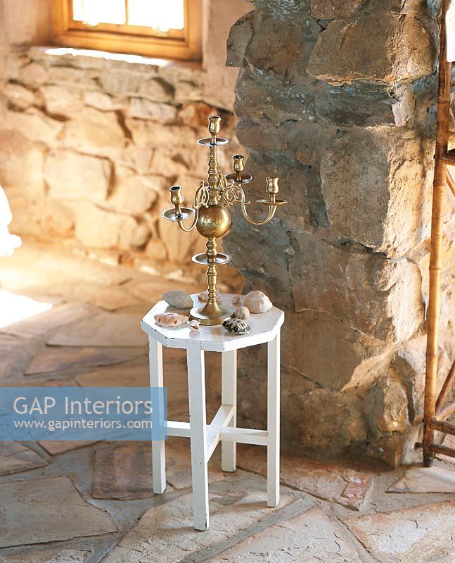 Candelabra and stones on stool
