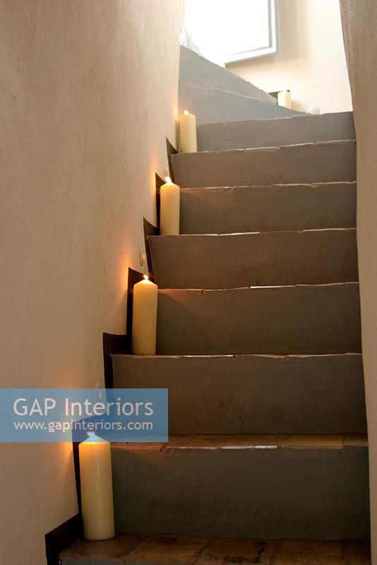 Stone stairs lit with candles