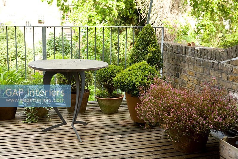 Small decked balcony with table