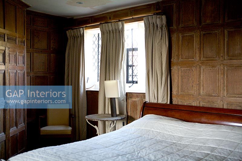 Traditional bedroom with wooden panelling