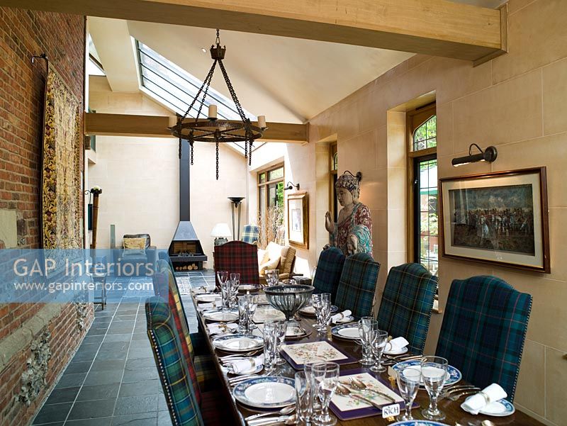 Modern long dining room with tartan chairs
